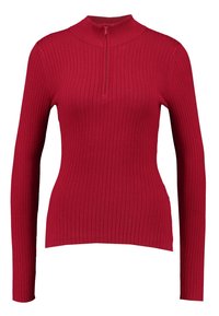 Červený top s dlouhým rukávem a vysokým límcem, který má uzávěr na půl zip a ribbed strukturu po celém povrchu. Přiléhavý design s hladkým povrchem.