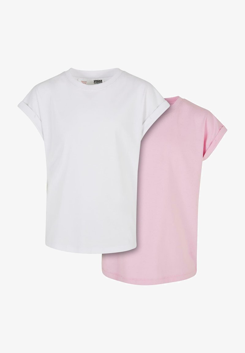 Two short-sleeve t-shirts in white and light pink cotton, featuring round necklines and rolled sleeves. Smooth texture, relaxed fit.