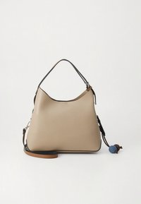 Beige leather shoulder bag with a curved design, a dark trim, and a brown strap. Features a decorative multicolored pom-pom detail.