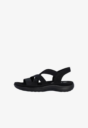 Black open-toe sandal with crisscross elastic straps, cushioned sole, and back strap, designed for casual wear and comfort.