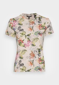 Beige t-shirt som sitter åtsittande med färgglada tropiska blommor och subtila Mickey Mouse-skisser över hela tyget.