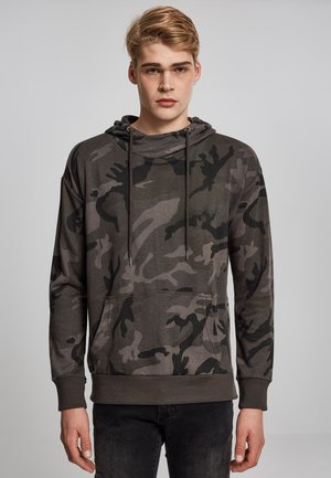 Sudadera tipo camuflaje en tonos gris oscuro, mezcla de algodón, con un bolsillo tipo canguro, capucha con cordón y puños acanalados. Diseño de corte relajado.