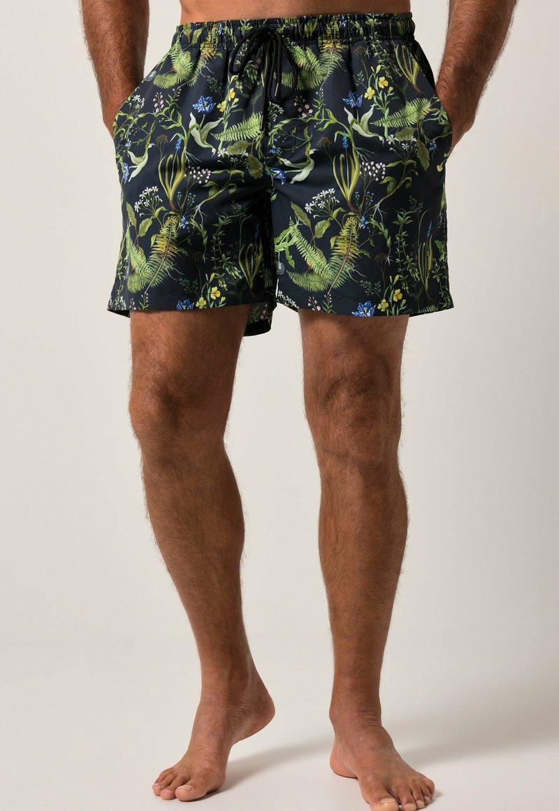 Costume da bagno neri con un vivace motivo floreale verde e blu, vita elastica con cordino e tasche laterali.