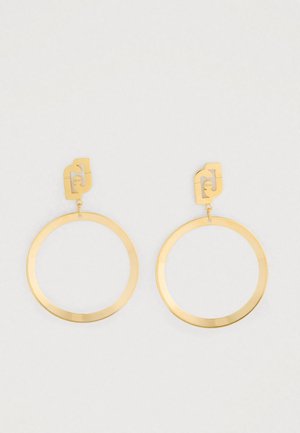 Kullatud ringehted geometriliste studidega ja minimalistlik avatud ringikujuline disain valgel taustal.