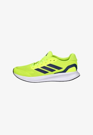 Zapatilla deportiva de color amarillo brillante con parte superior de malla transpirable, detalles en azul oscuro y suela blanca con patrones texturizados para mayor agarre.