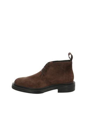 Brown suede ankle boots with black rubber soles, featuring a round toe, two eyelets for laces, and a pull tab at the back.