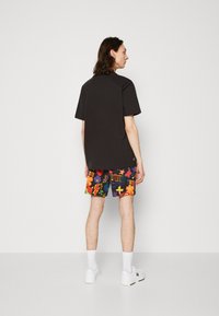 Puma DOWNTOWN PRIDE - T-shirt basic - black