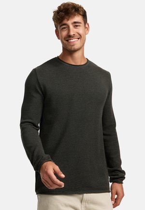Maglione a maniche lunghe verde scuro con colletto a girocollo realizzato in tessuto Texturizzato, con polsini aderenti e orlo dritto.