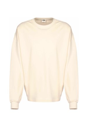 Cream-colored oversized sweatshirt with long sleeves, a round neck, and ribbed cuffs. Made from soft, smooth material, minimal design.