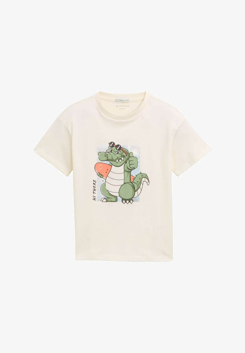Krémové tričko s grafikou vtipného zeleného krokodíla so slnečnými okuliarmi, ktorý drží melón, a nápisom "AHOJ" v čiernej farbe.