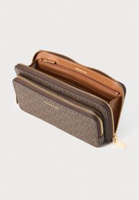 Brown patterned wallet with a smooth leather interior, gold zippers, and a brand name embossed on the front. Two compartments, zippered closure.