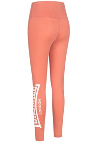 Ljus korallfärgade leggings i stretchigt material, med hög midja och vit logotryck på vänster ben.