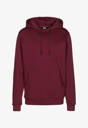 Burgundi színű kapucnis pulóver elülső zsebbe, fűzőkkel és bordázott mandzsettával. Puha anyagból készült, sima tapintású.