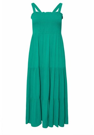 Longue robe verte sans manches avec un bodice smocké, de larges bretelles et une jupe à volants. Fabriquée en tissu léger et texturé.