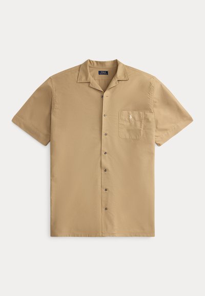 Beige Kurzarmhemd mit Knopfleiste, Brusttasche und Kragen, mit kleinem besticktem Logo auf der Tasche.