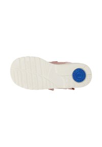 Rosa Schuhe mit einer weißen Außensohle. Die Sohle hat strukturierte Rillen und ein blaues Akzentlabel mit der Aufschrift "SUPER ABSORB."
