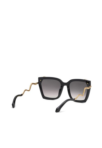 Lunettes de soleil carrées noires avec verres dégradés foncés et branches décoratives dorées en forme de serpent sur fond blanc.
