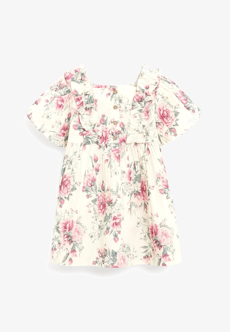 Robe crème à fleurs avec imprimés roses et verts, encolure carrée à volants, manches courtes bouffantes et boutons en bois sur le devant.