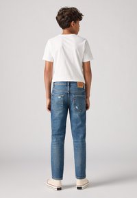 Levi's® SLIM  - Karcsúsított farmerek - kobain/raw hem
