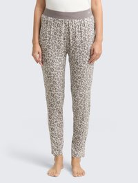 Kamelian ja vaaleanruskeat leopardikuosiset pyjamahousut, joissa on joustava harmaa vyötärö ja kapeneva lahjerakenne istuvan ilmeen saavuttamiseksi.