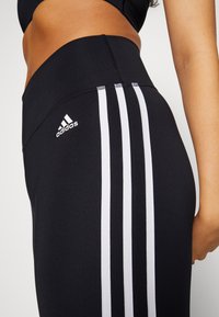 adidas Performance FLARED - Donji dijelovi trenirke - black