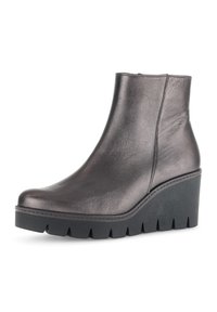 Metallic gray ankle boot with a smooth leather texture, rounded toe, and a black wedge sole featuring pronounced grooves.
