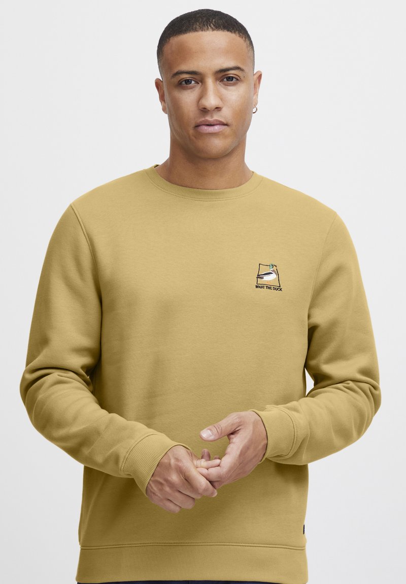 Yellow cotton sweatshirt with ribbed cuffs, crew neck, and a small embroidered design featuring a duck. Smooth texture, regular fit.