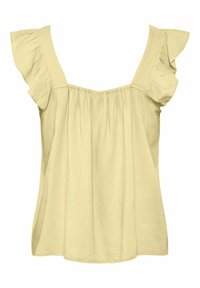 Blouse beige clair sans manches avec larges bretelles et manches à volants, avec un corsage ample et froncé.