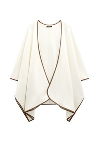 Kremowy narzutka z drapowanym fasonem, ozdobiona brązowym wykończeniem wzdłuż brzegów i otwartym przodem. Miękka tkanina.