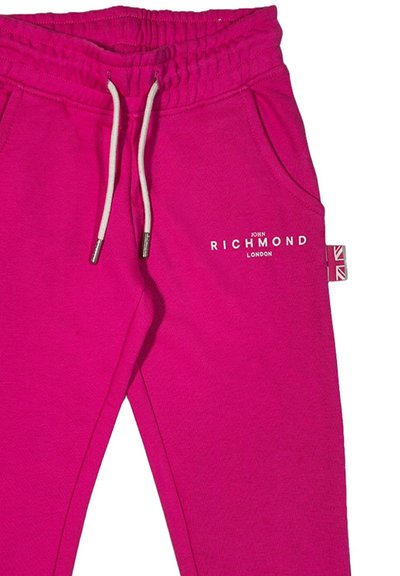 Pantaloni della tuta fucsia con cintura elastica e cordoncino. Presentano tasche laterali e un logo stampato sulla coscia sinistra. Tessuto testurizzato.