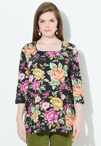 Schwarze Tunika mit drei Viertelärmeln, die große rosa, gelbe und grüne Rosen zeigt. Weicher Stoff mit quadratischem Ausschnitt und lockerer Passform.