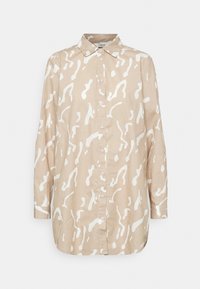 Chemise beige à boutons, ornée d'un motif abstrait blanc, avec un col, des manches longues et un ourlet légèrement arrondi. Fabriquée en tissu léger.