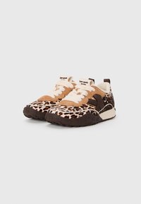 Leopard print sneakers with brown suede accents, cream laces, and a textured rubber sole. Brand label on tongue. Low-profile design.