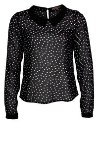 Blusa negra transparente con lunares blancos, mangas largas, cuello redondo y una apertura en forma de ojal en la parte posterior, con puños negros.