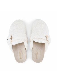 White, fluffy slipper with a textured, faux fur exterior, and a soft, beige insole. Features a decorative bow accent on the side.