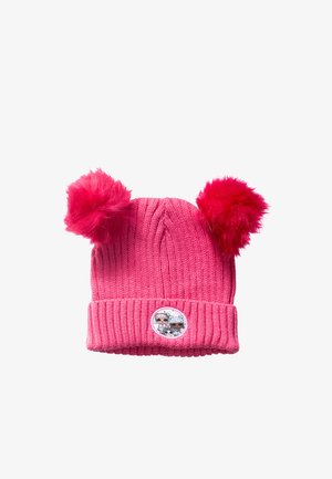 Pink knitted children’s hat with two large fuzzy pom-poms and a small round patch depicting two cartoon characters on the front cuff.