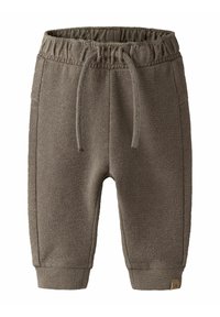 Pantalon de jogging tricoté marron pour enfants avec ceinture élastique, cordon de serrage, poches latérales et chevilles resserrées.