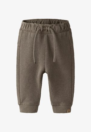 Children's brown knitted jogger pants with elastic waistband, drawstring, side pockets, and cuffed ankles.