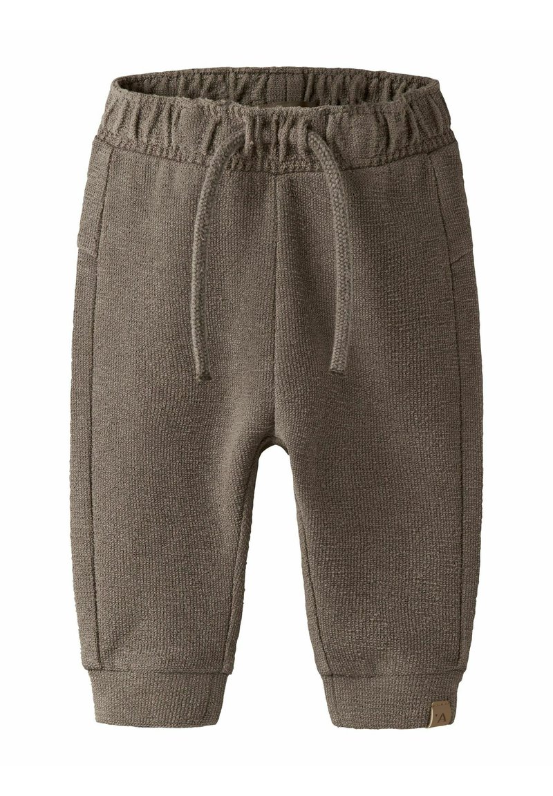 Pantalon de jogging tricoté marron pour enfants avec ceinture élastique, cordon de serrage, poches latérales et chevilles resserrées.