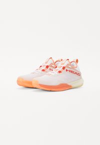 White athletic shoes featuring an orange gradient sole, mesh upper, structured design, and "HEAD" branding on the side for visibility.