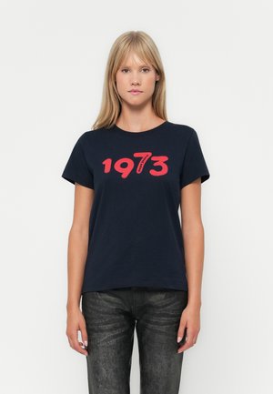 Navy blue cotton t-shirt featuring a large red print of "1973" across the chest. Short sleeves and a round neckline.