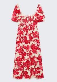 Robe midi crème avec motif floral rouge, manches courtes bouffantes, corsage smocké et décolleté carré.