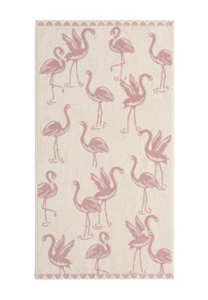 Rektangulært lysebeige tæppe med et gentaget mønster af lyserøde flamingoer, der står og spreder vinger, omgivet af en bølget kant.