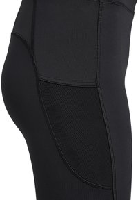 Zwarte sportlegging met een gladde textuur, voorzien van een mesh paneel aan de zijkant en versterkte stiksels voor duurzaamheid.