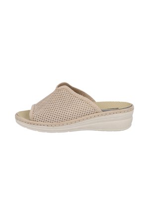 Sandalia beige tipo slip-on con punta abierta, parte superior perforada y suela acolchada, diseñada para comodidad casual y facilidad de uso.
