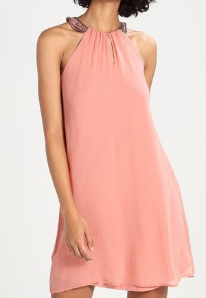 Pink sleeveless dress with a pleated texture and halter neck, featuring a decorative detail on the collar and an A-line silhouette.