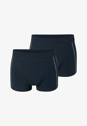 Deux paires de boxers bleu marine foncé avec des ceintures plates et des bandes blanches verticales sur les côtés, présentées sur un fond blanc.