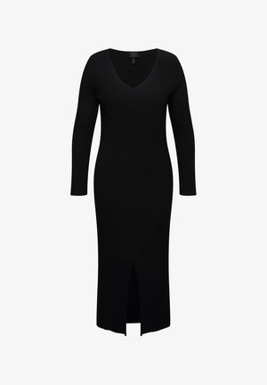 Vestido negro acanalado con escote en V, mangas largas y una abertura en el muslo en la parte delantera. Presenta una silueta ajustada y una tela texturizada.