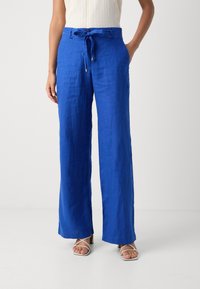 Blue linen trousers with a wide-leg design, drawstring waist, and side pockets. Texture appears soft and slightly crinkled.