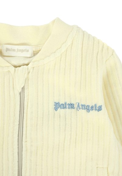 Giacca gialla a costine con zip realizzata in morbido tessuto, caratterizzata da un logo ricamato "Palm Angels" di colore azzurro chiaro sul lato sinistro.